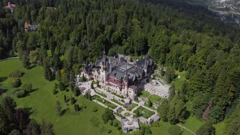 royal peles castle aerial perspective in picturesque romanian mountain landscape, carpathian area panoramic