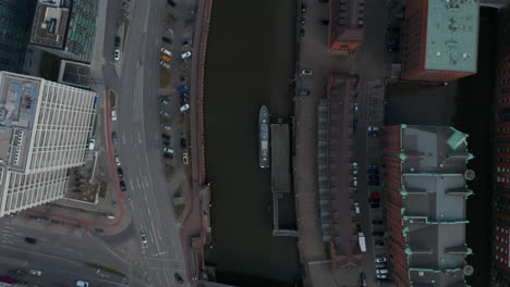 Overhead-top-down-aerial-view-of-cars-and-traffic-by-Elbe-river-canal-in-Hamburg-city-center