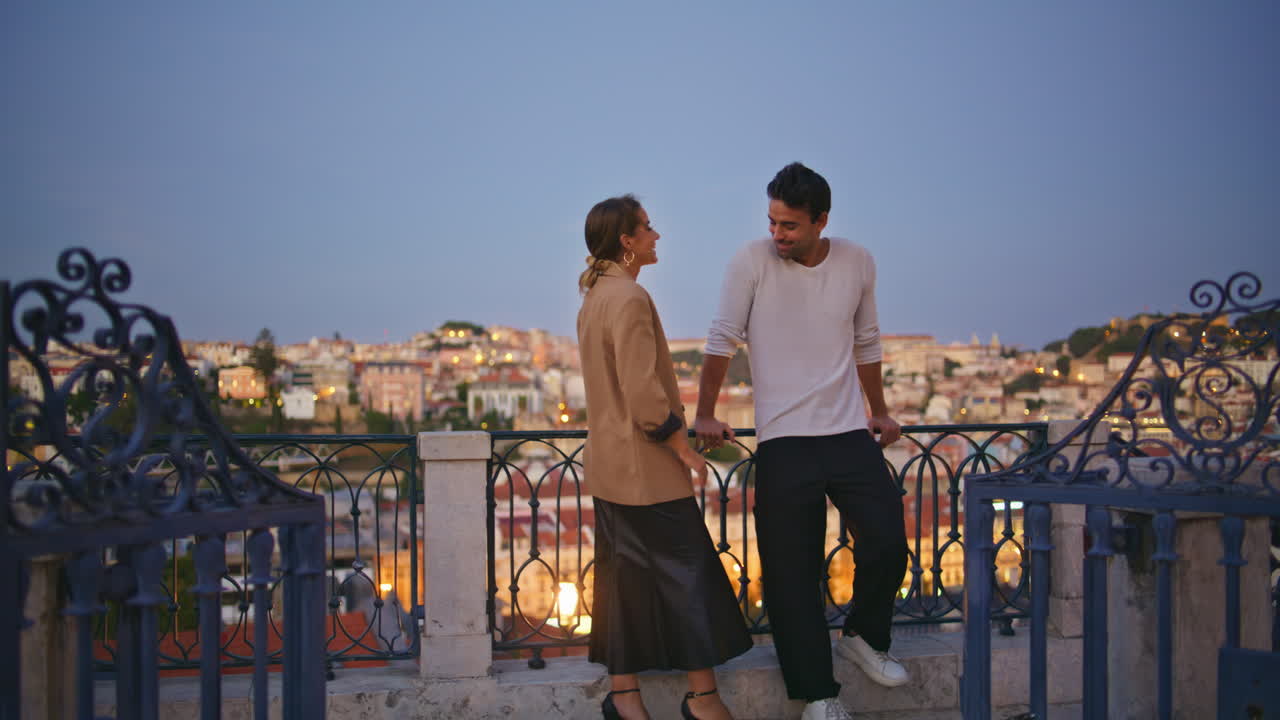 Laughing people enjoying date resting summer evening together. Happy pair flirt