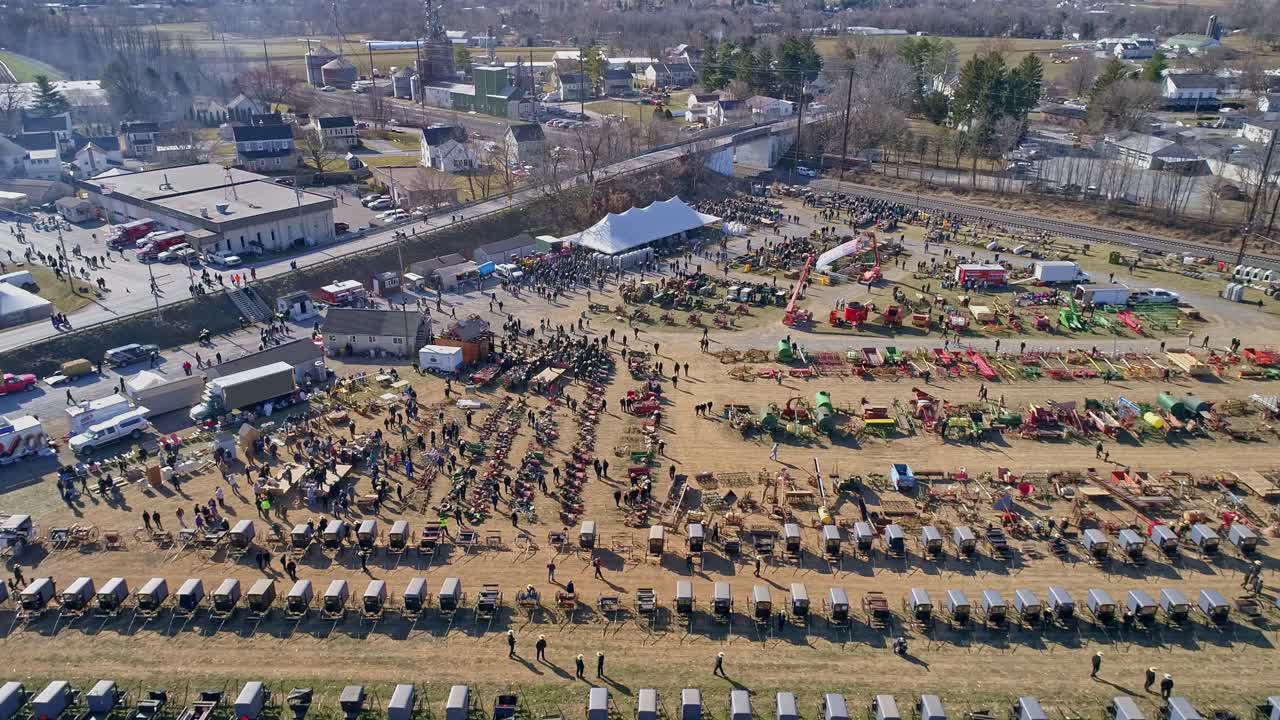 An Aerial View of an Amish Mud Sale Selling Buggies, Quilts and Other Amish Crafts