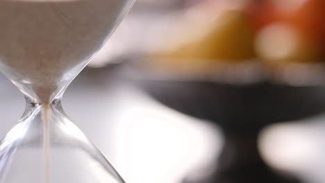 hourglass sand falling in slow motion