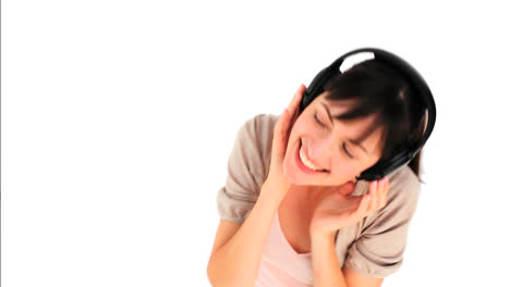 cute brunette girl listening to music