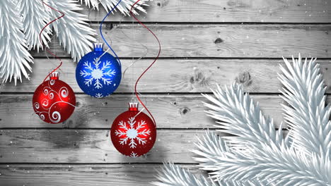 composición de video con nieve sobre decoraciones de navidad en madera