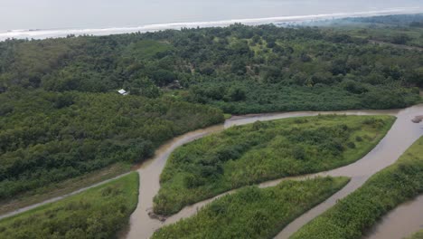 Aerial-reveal-of-the-rio-cotos-river-mouth-on-the-central-pacific-coast-of-Costa-Rica