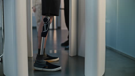 person with prosthetic leg at security check