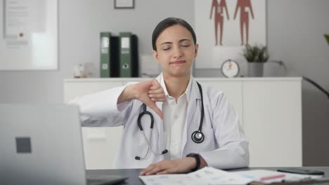 Upset-Indian-female-doctor-showing-thumbs-down