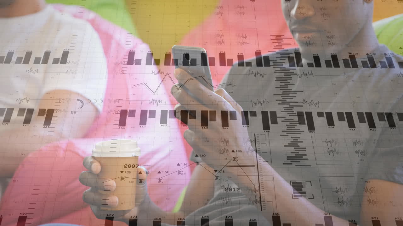 Two colleagues sitting on couch sipping coffee and checking smartphone while showing finance charts