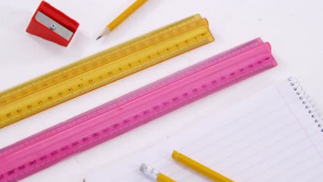 scale rulers with pencils, sharpener and diary