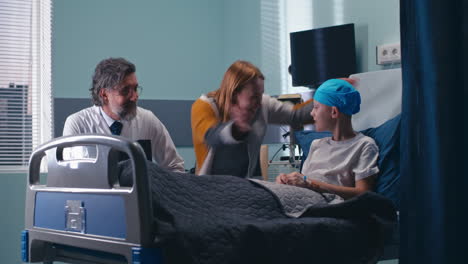 family visiting a child in the hospital