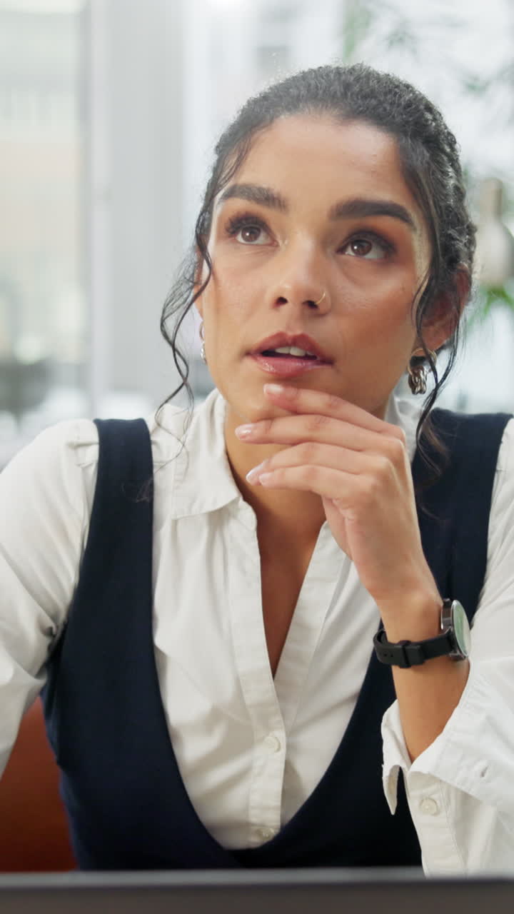 Young Woman Thinking and Smiling in a Calm Office Setting