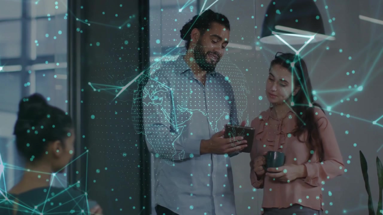 Man tapping tablet revealing tech data map while woman inspecting nodes and exchanging looks
