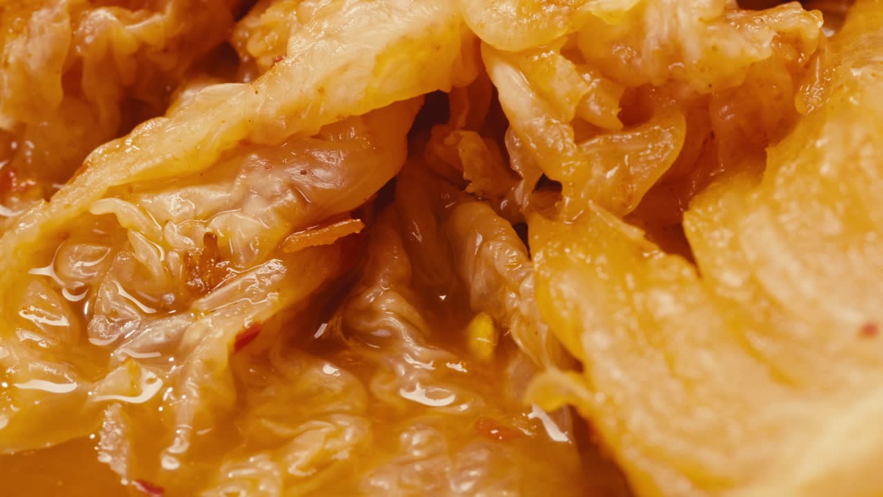 Close-up of texture fermented spicy cabbage kimchi with in can. Preservation of vegetables in glass jars. Fermentation preserved kimchi cabbage with spices macro. Asian cuisine.