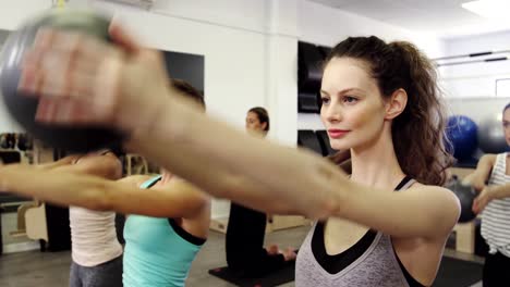 Beautiful-women-exercising-in-fitness-studio