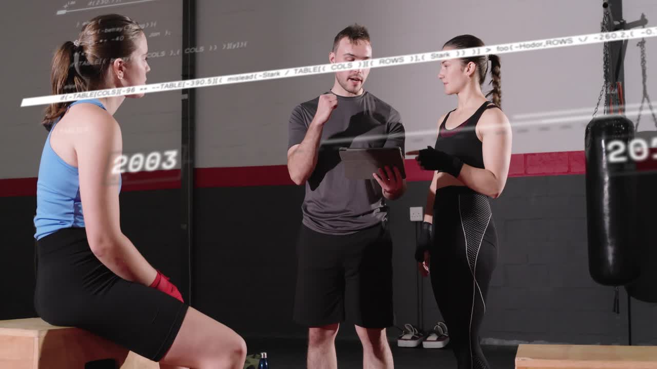 Coach tapping tablet, timeline graphic sweeping across two athletes shifting, agreeing boxing plan