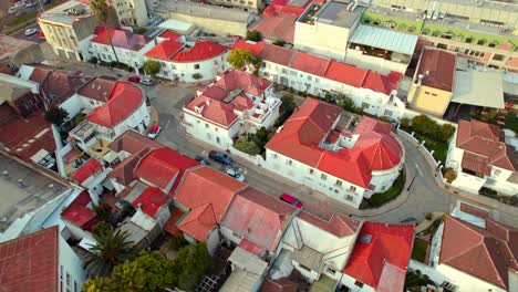 drone fly conjunto virginia opazo architecture at republica neighborhood of santiago de chile, red roof tile houses at daylight