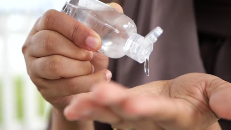 women hand using sanitizer gel for preventing virus with copy space