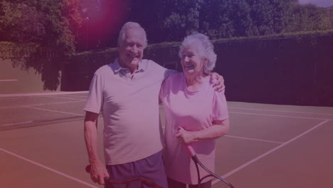 elderly couple posing on tennis court, displaying animated health stats graph and heart rate icons