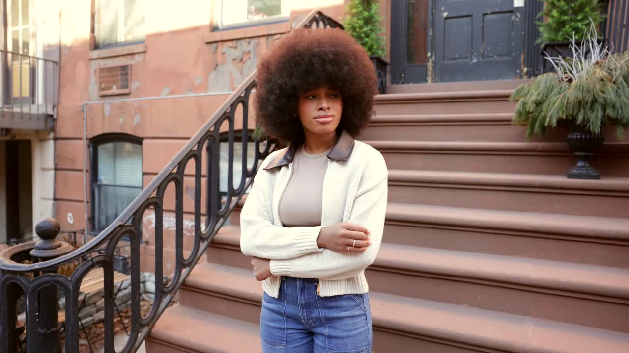 Woman with Afro on Brownstone Steps