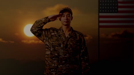 asian man soldier saluting while standing with flag of the united states, sunset time