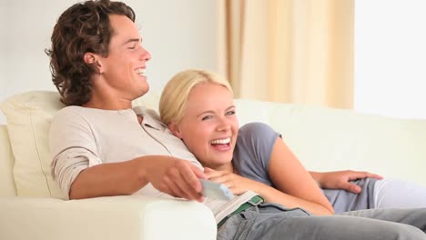 cute couple watching tv