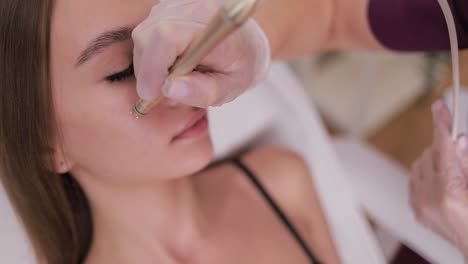 woman undergoing a cosmetic facial treatment