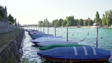 slow motion of fishing boats at lake constance with turquoise water