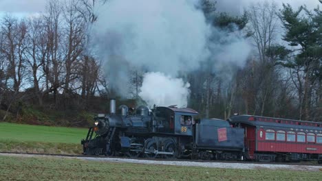 vintage steam train chugging through the countryside