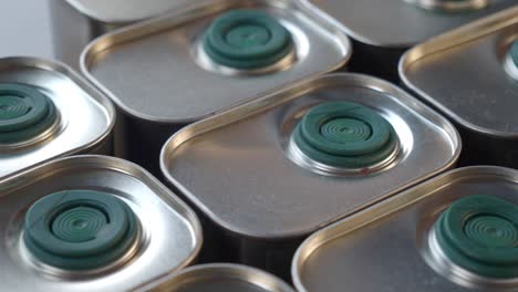 stacked metal olive oil cans