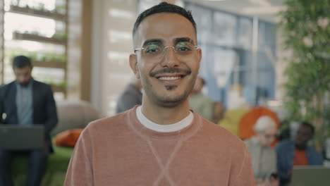 smiling man in an office setting