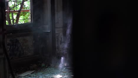 dust, light rays and spider webs in abandoned place