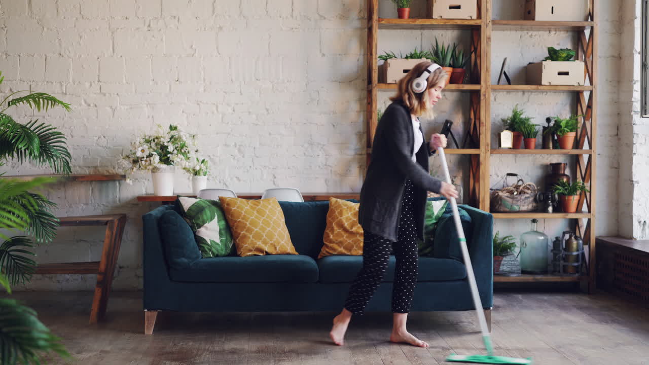 Woman Cleaning and Dancing in Her Living Room