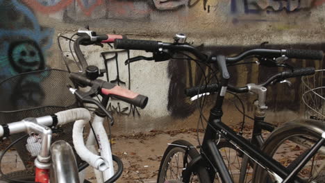 a close-up of a bicycle's handlebars, with the grips, brakes, and frame all in sharp focus