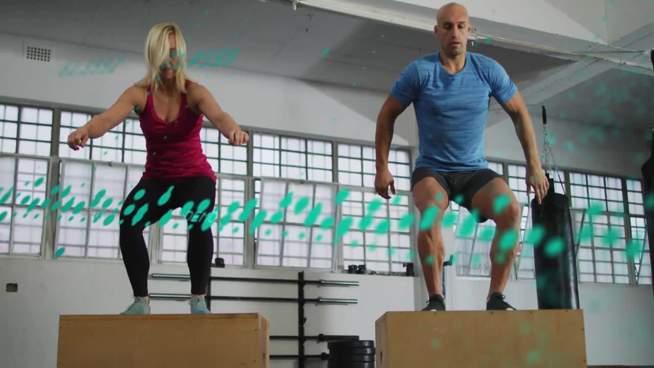 Two people exercising with digital data animation overlay in gym setting