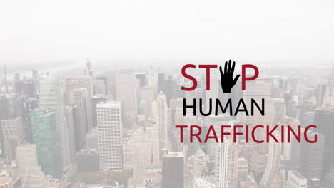 animation of stop human trafficking text over cityscape