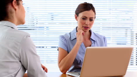 Colleagues-chatting-in-the-office