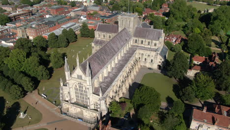 orbiting drone shot over winchester cathedral, filmed in summer in hampshire, uk