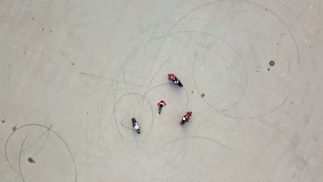 motorbikers riding around woman. aerial view of modern motorbike on the parking road riding
