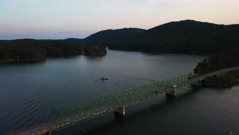 Aerial-footage-of-vehicles-passing-on-trust-road-bridge-over-Lake-Allatoona