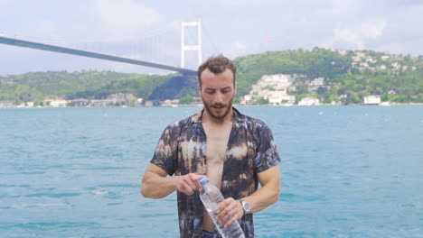 the man who drinks water. slow motion.