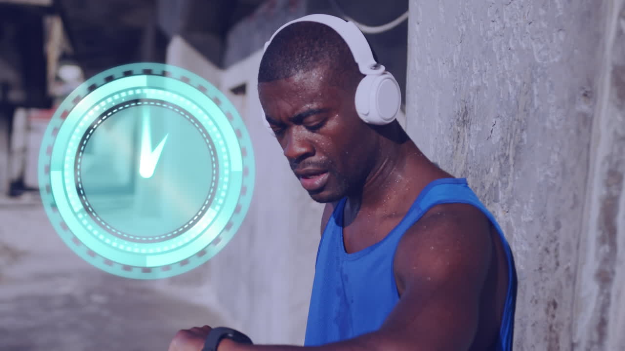 Animation of clock over running african american man in headphones using smartwatch