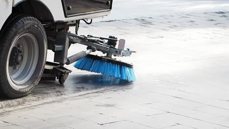 street sweeper cleaning cobblestones