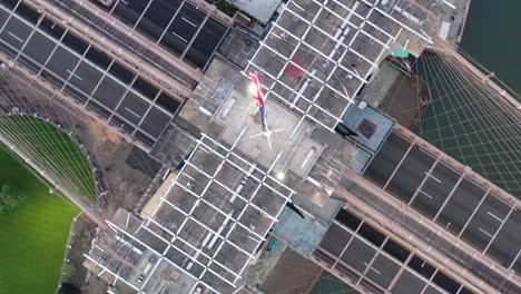 a top down view directly over the brooklyn bridge east tower at sunrise