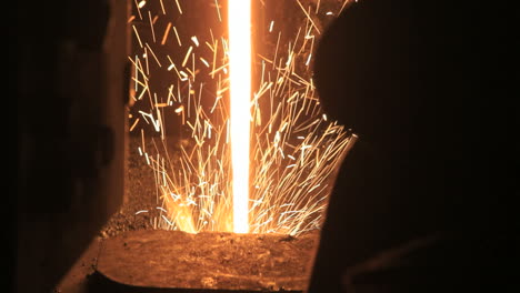 stream of liquid metal with sparks. iron and steel production