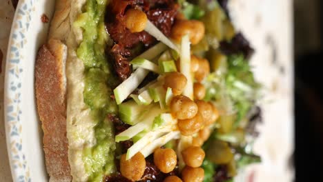 gourmet hummus and avocado toast with chickpeas and apple