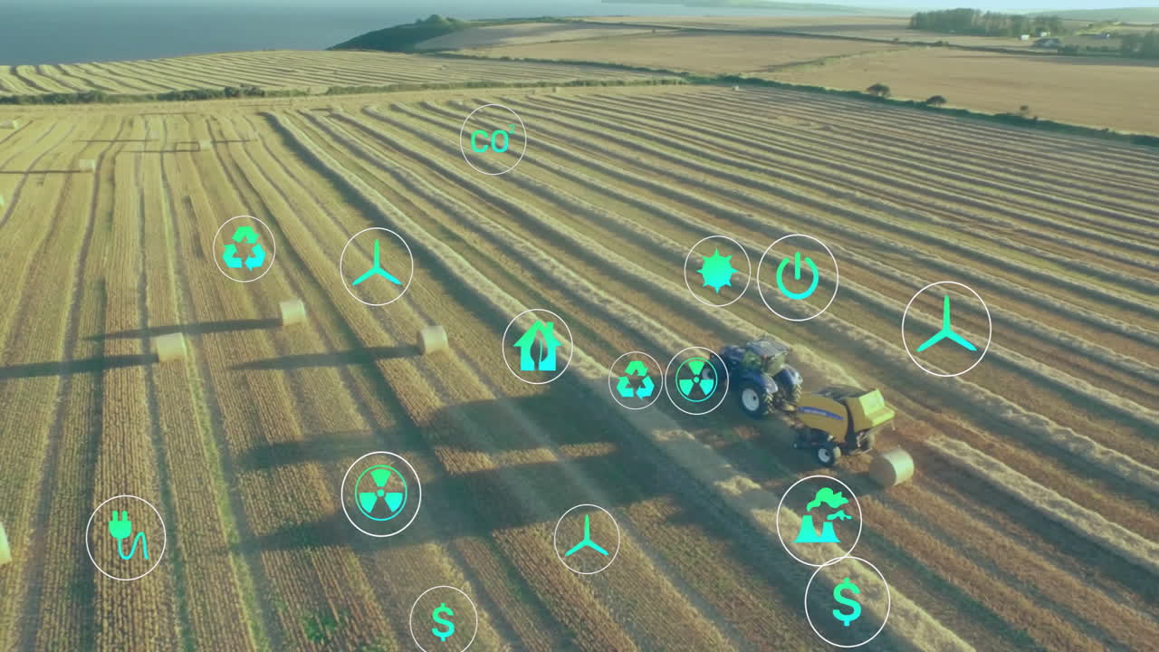 Displaying aerial farmland with blue tractor towing yellow baler moving through rows with eco icons