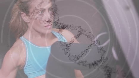 animación de la hebra de adn girando y círculos sobre mujer en forma haciendo ejercicio con pesas