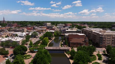 Aerial-Boom-Shot-Reveals-Downtown-Naperville,-Illinois-on-Beautiful-Sunny-Day-in-Summer