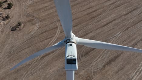 very close orbiting shot of wind turbines spinning