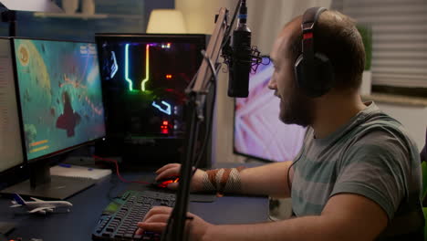 winner streamer playing online space shooter game in gaming room