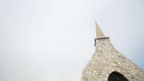 small stone chapel with spire